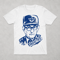 White t-shirt with blue graphic of a Raul Castro in military uniform and 'INDICTED' text on a gray background